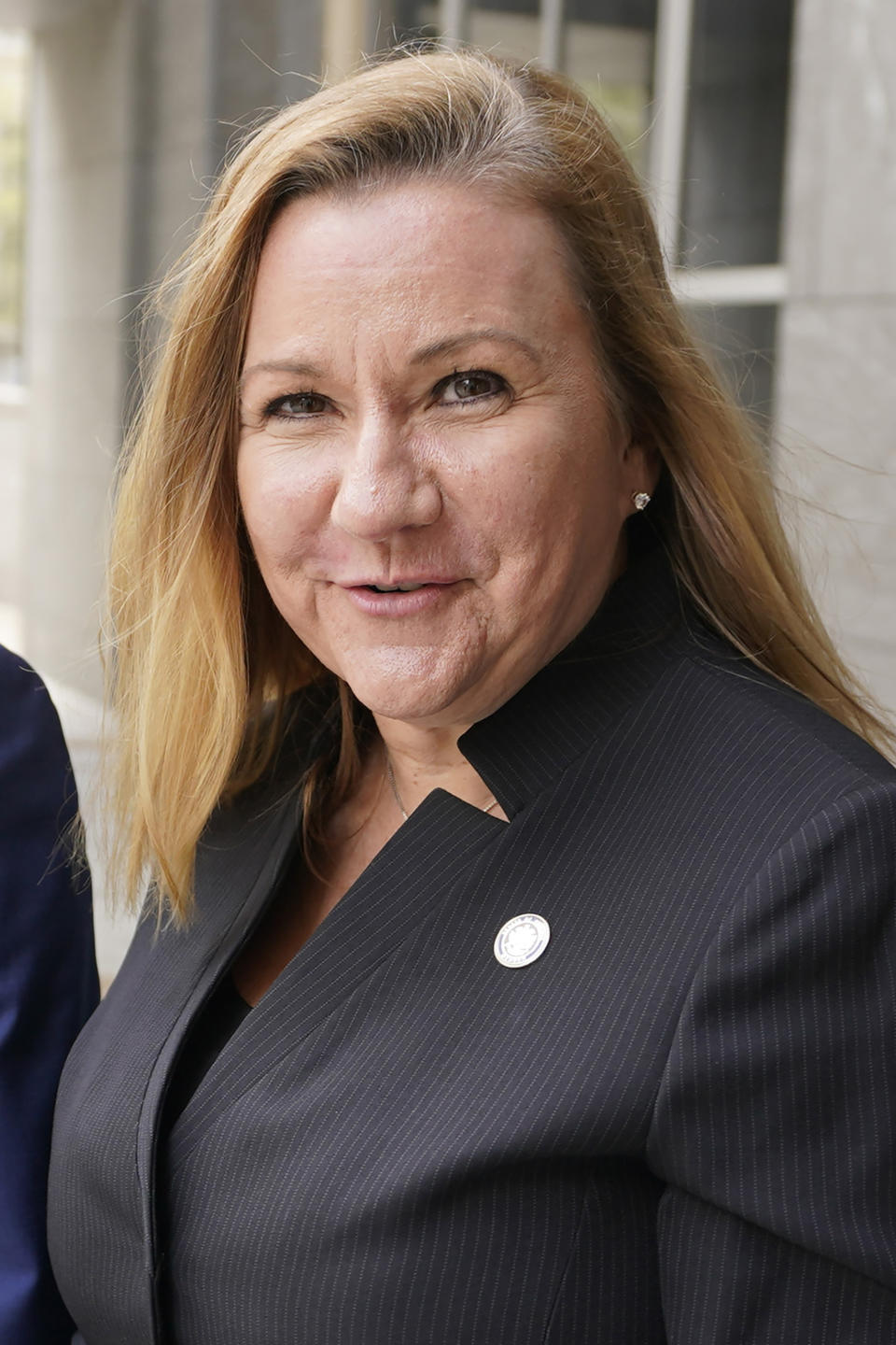 FILE This Thursday April 1, 2021 file photo shows Virginia State Sen. Amanda Chase, R-Chesterfield, right, leaves court during a break in a hearing to dismiss a lawsuit in Federal court in Richmond, Va. The GOP gubernatorial candidate will be chosen during the party's May 8 nominating convention. (AP Photo/Steve Helber)