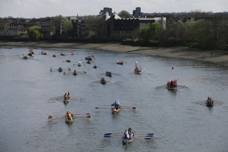 People row along the River Thames ahead of the annual Oxford-Cambridge Boat Race in London, on April 2, 2017