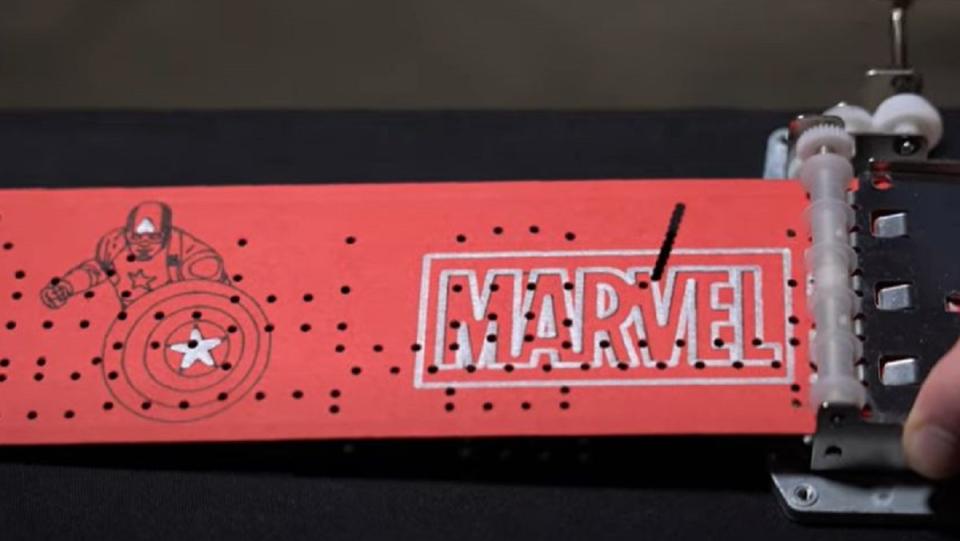 An image of a Marvel Studios music box scroll