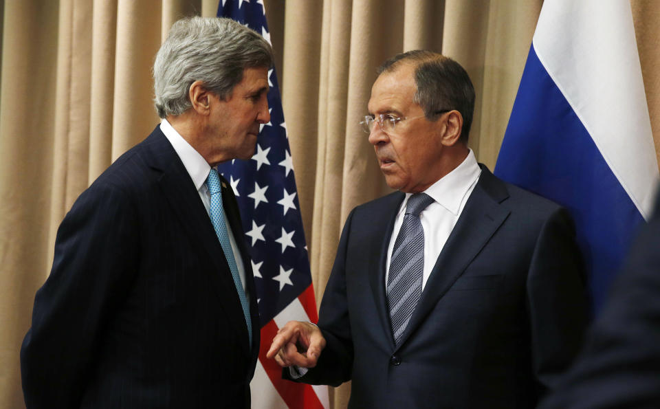 FILE - In this April 17, 2014, file photo, U.S. Secretary of State John Kerry, left, talks with Russian Foreign Minister Sergey Lavrov at the start of a bilateral meeting to discuss the ongoing situation in Ukraine in Geneva. Nearly a quarter century after the Cold War ended, the crisis in Ukraine symbolizes the weak foreign policy hand the United States often finds itself playing despite its status as the only global superpower. Kerry last week in Geneva negotiated a deal with Russia, Ukraine and the European Union that was designed to ease tensions. (AP Photo/Jim Bourg, Pool)