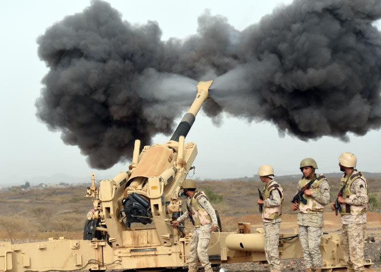 Saudi army fire shells towards Yemen from a post close to the Saudi-Yemeni border on April 13, 2015