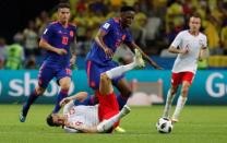 Soccer Football - World Cup - Group H - Poland vs Colombia - Kazan Arena, Kazan, Russia - June 24, 2018 Colombia's Yerry Mina in action with Poland's Robert Lewandowski REUTERS/Toru Hanai