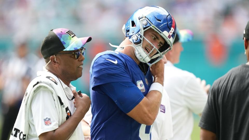 New York Giants quarterback Daniel Jones (8) leaves the game with an injury against the Miami Dolphins during the second half of an NFL game at Hard Rock Stadium in Miami.