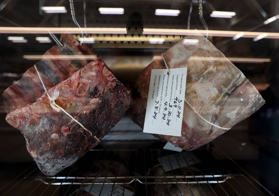 A dry-aging case at the new Fort Worth Alliance H-E-B allows customers to dry-age a selection of beef for up to 21 days. Amanda McCoy/amccoy@star-telegram.com