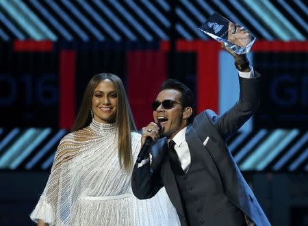 Marc Anthony accepts an award honoring him as Latin Recording Academy person of the year from presenter Jennifer Lopez at the 17th Annual Latin Grammy Awards in Las Vegas, Nevada, U.S., November 17, 2016. REUTERS/Mario Anzuoni