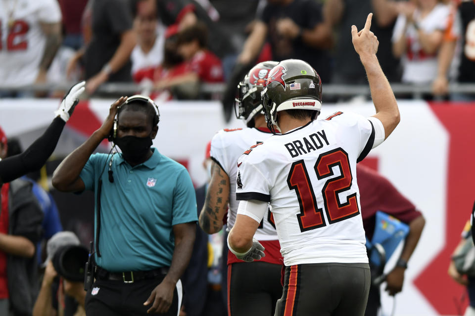 Tampa Bay Buccaneers quarterback Tom Brady (12) reacts after throwing his 600th career touchdown pass during the first half of an NFL football game against the Chicago Bears Sunday, Oct. 24, 2021, in Tampa, Fla. (AP Photo/Jason Behnken)