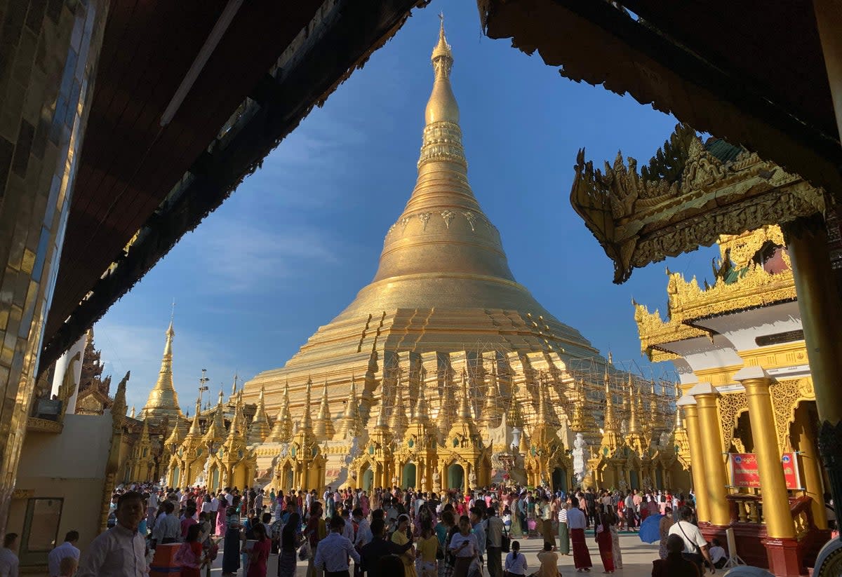 Buddhist devotees visit Shwedagon pagoda to mark the full moon of the Thadingyut festival  (AFP via Getty Images)