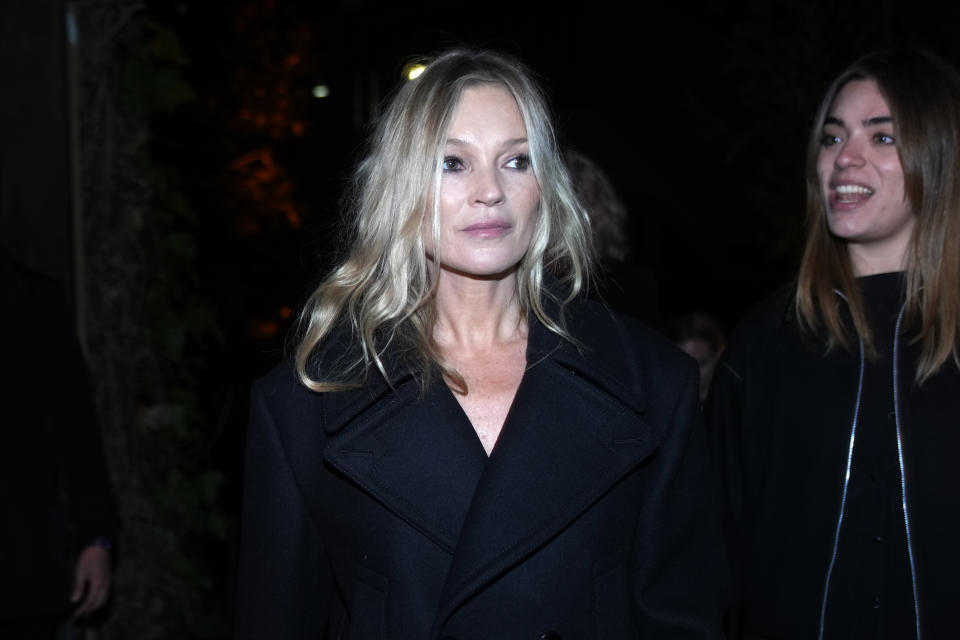Kate Moss arrives prior to the start of the Bottega Veneta women's Fall-Winter 2024-25 collection presented in Milan, Italy, Saturday, Feb. 24, 2024. (AP Photo/Luca Bruno)