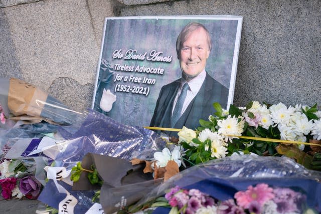 Flowers left in memory of Sir David Amess outside the Houses of Parliament 