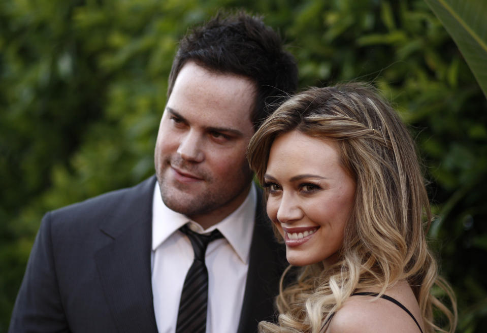 FILE - In this May 11, 2011 file photo, Hilary Duff, right, and Mike Comrie arrive at an Evening of "Southern Style" presented by The St. Bernard Project and the Spears Family in Beverly Hills, Calif. Duff and her husband Comrie are calling it quits after three years or marriage according to Duff's reps. on Friday, Jan. 10, 2014. (AP Photo/Matt Sayles, File)