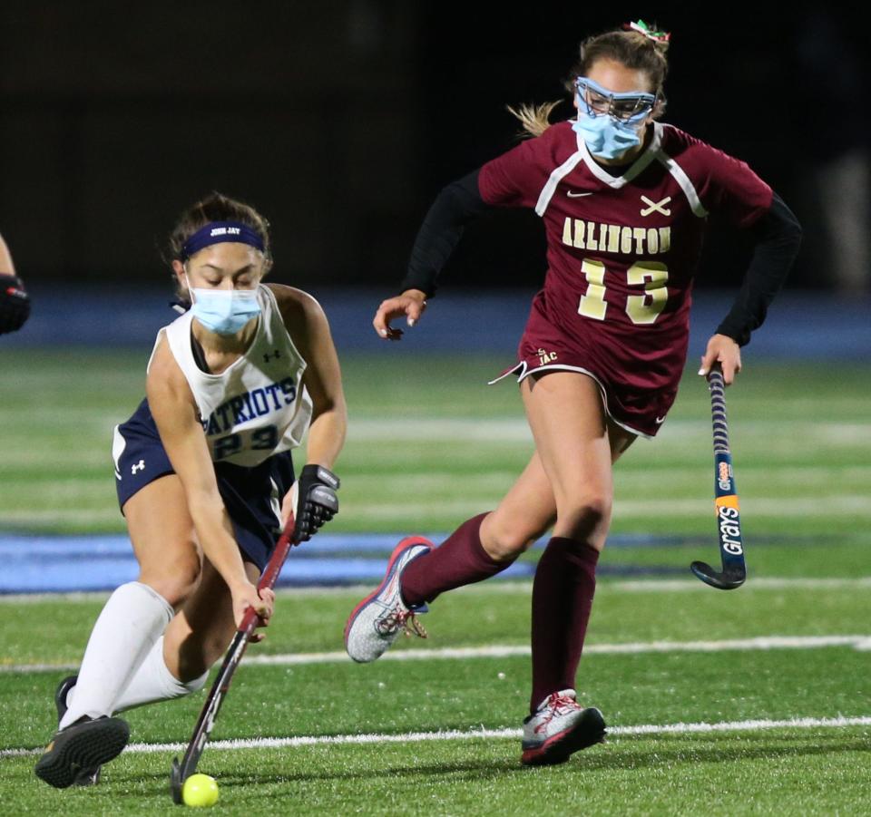 John Jay's Rachel Tama drives up field against Arlington during a Nov. 16, 2020 field hockey game.