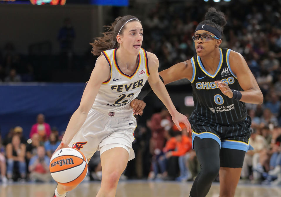 CHICAGO, IL - JUNE 23: Caitlin Clark #22 of the Indiana Fever drives past Diamond DeShields #0 of the Chicago Sky during the first half on June 23, 2024 at Wintrust Arena in Chicago, Illinois. (Photo by Melissa Tamez/Icon Sportswire via Getty Images)