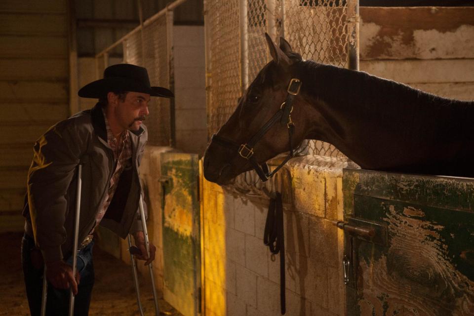 In this Sept. 9, 2012 image provided by Allied-THA, Chip Woolley, played by actor Skeet Ulrich, talks with Mine That Bird in a scene from the movie “50-1." (AP Photo/Courtesy of Allied-THA)