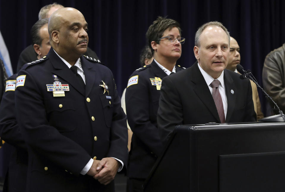 Detective Commander Edward Wodnicki, right, of Chicago Police Department, speaks at a news conference at police headquarters as Chicago Police Supt. Eddie Johnson, left, listens, Thursday, Feb. 21, 2019, in Chicago, after actor Jussie Smollett turned himself in on charges of disorderly conduct and filing a false police report. The "Empire" staged a racist and homophobic attack because he was unhappy about his salary and wanted to promote his career, Johnson said Thursday. (AP Photo/Teresa Crawford)