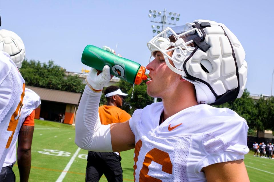 Texas defensive back Michael Taaffe grabs a drink of water during the Longhorns' first preseason camp on July 31. The Longhorns' season opener is at 2:30 p.m. Saturday.