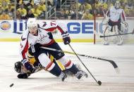 May 4, 2016; Pittsburgh, PA, USA; Washington Capitals right wing T.J. Oshie (77) fights off Pittsburgh Penguins center Oskar Sundqvist (40) as he chases the puck during the third period in game four of the second round of the 2016 Stanley Cup Playoffs at the CONSOL Energy Center. Mandatory Credit: Charles LeClaire-USA TODAY Sports