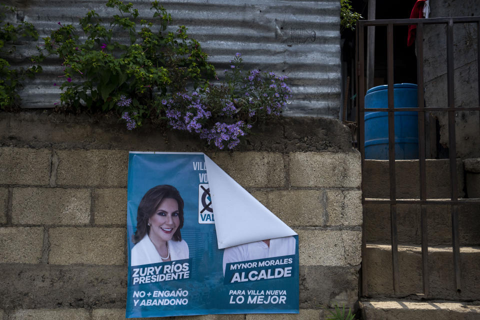 A campaign banner of Zury Rios Sosa, presidential candidate for the coalition of Valor and Unionista parties hangs in front of a house at the Mario Alioto low-income neighborhood in Villanueva, Tuesday, May 16, 2023. Rios Sosa, daughter of late dictator Efraín Ríos Montt and the standard-bearer for the far-right Valor-Unionista coalition, has expressed admiration for both El Salvador´s President Nayib Bukele and former Colombian President Alvaro Uribe, who led an all-out offensive against leftist guerrillas during his presidency in 2002-2010. (AP Photo/Moises Castillo)