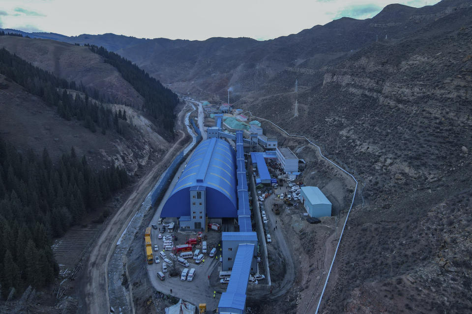 In this aerial photo released by Xinhua News Agency, shows rescue workers at a flooded coal mine in Hutubi county in of Hui Autonomous Prefecture of Changji, northwest China's Xinjiang Uyghur Autonomous Region on Sunday, April 11, 2021. Some miners were reported trapped after the coal mine flooded on Saturday. (Gao Han/Xinhua via AP)