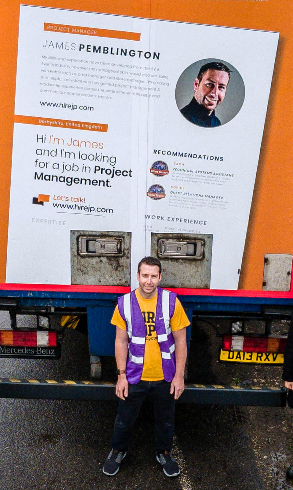 James Pemblington in front of the lorry with his CV on the back. (SWNS)