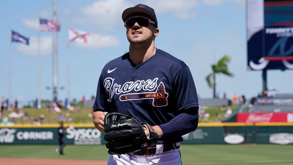 Atlanta Braves right fielder Adam Duvall (14) heads to the dugout in the second inning during a spring training baseball game against the Toronto Blue Jays at CoolToday Park Monday March 28, 2022, in North Port, Fla.
