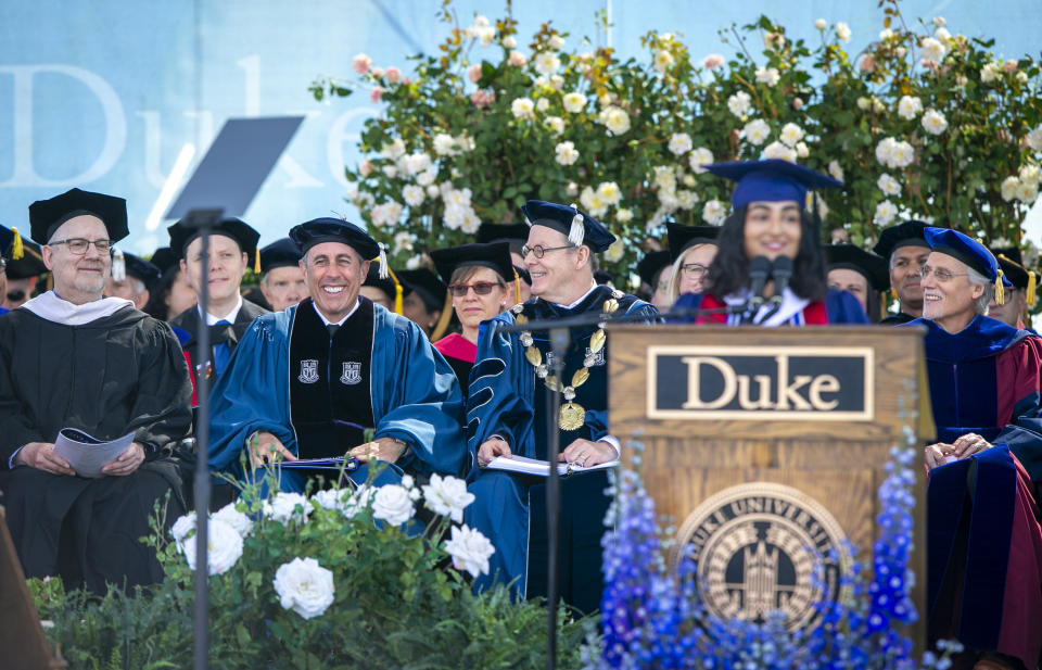 This photo provided by Duke University shows commencement speaker Jerry Seinfeld, front row second from left, on stage during the school's graduation ceremony, Sunday, May 12, 2024, in Durham, N.C. A tiny contingent of graduates opposed the pro-Israel comedian speaking at their commencement Sunday, with about 30 of the 7,000 students leaving their seats and chanting “Free Palestine!” amid a mix of boos and cheers. (Jared Lazarus/Duke University via AP)