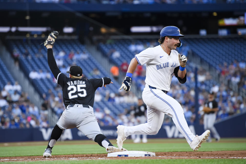 Toronto Blue Jays' Davis Schneider (36) is forced out by Chicago White Sox first baseman Andrew Vaughn (25) during the fourth inning of a baseball game in Toronto on Tuesday, May 21, 2024. (Christopher Katsarov/The Canadian Press via AP)