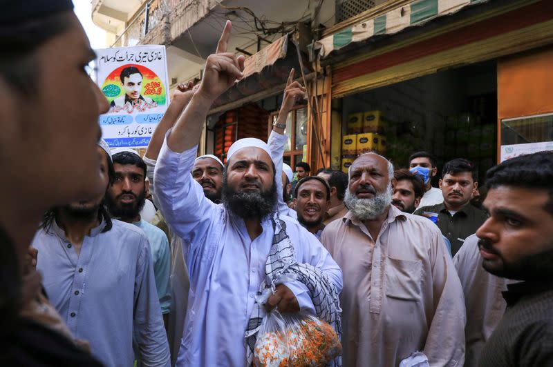 People chant slogans in favour of a man who, according to the Pakistani police, is suspected of killing U.S. national Tahir Ahmed Naseem during a proceeding at a judicial complex, in a protest rally demanding his release, in Peshawar,