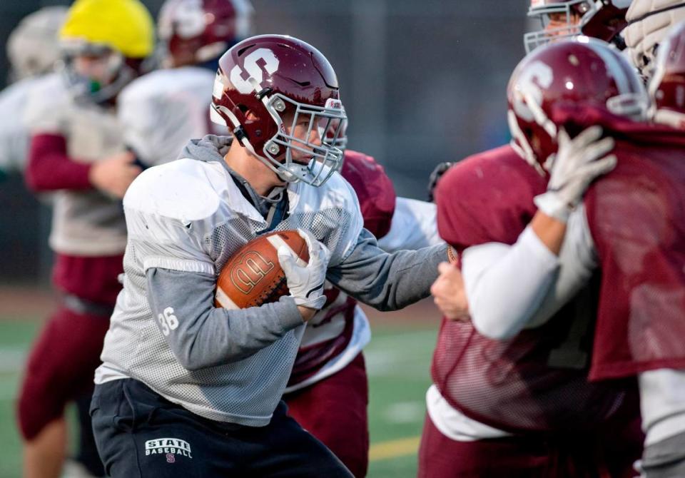 State College’s Brady Bendik runs a play during football practice on Tuesday. The Little Lions will face Mount Lebanon in the PIAA class 6A semifinals on Saturday.