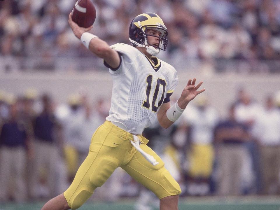 Tom Brady throws a pass while at Michigan in 1999.