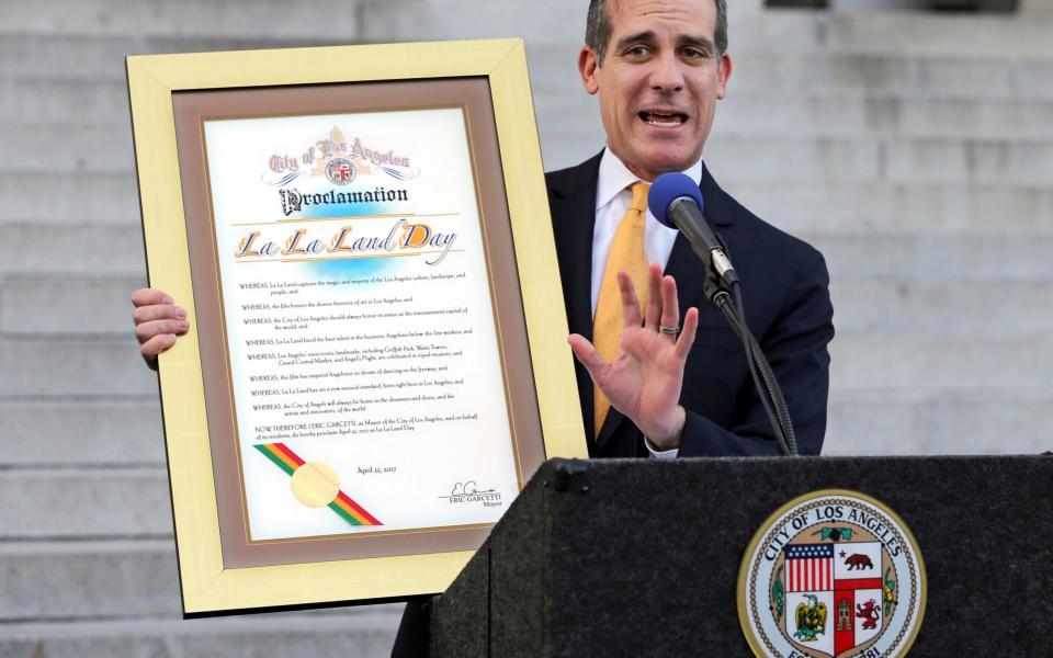 Los Angeles Mayor Eric Garcetti appears at a press event proclaiming "La La Land Day" - Credit: Reed Saxon/AP