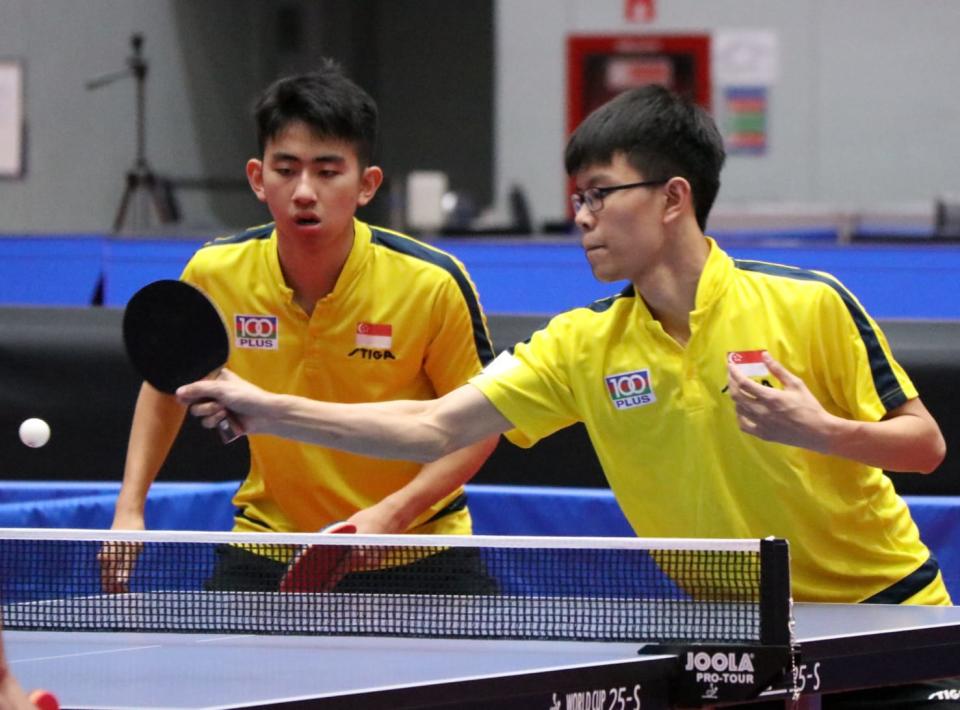 Koen Pang (left) and Josh Chua in action in the boys' doubles event at the ITTF World Junior Table Tennis Championships. (PHOTO: Singapore Table Tennis Association)