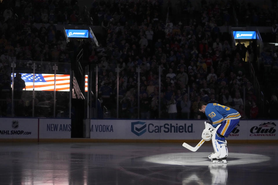 St. Louis Blues goaltender Jordan Binnington pauses for the national anthem before the start of an NHL hockey game against the Washington Capitals Saturday, Jan. 20, 2024, in St. Louis. (AP Photo/Jeff Roberson)
