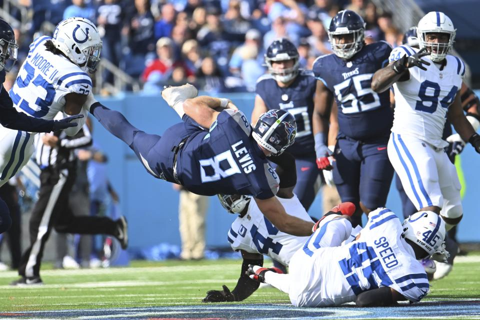 Tennessee Titans quarterback Will Levis (8) dives for a first down against Indianapolis Colts' E.J. Speed (45) during the first half of an NFL football game, Sunday, Dec. 3, 2023, in Nashville, Tenn. (AP Photo/John Amis)