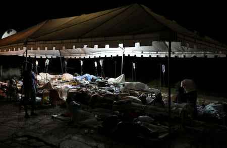 People injured in an earthquake that hit northern Haiti late on Saturday, sleep in a tent, in Port-de-Paix, Haiti, October 7, 2018. REUTERS/Ricardo Rojas