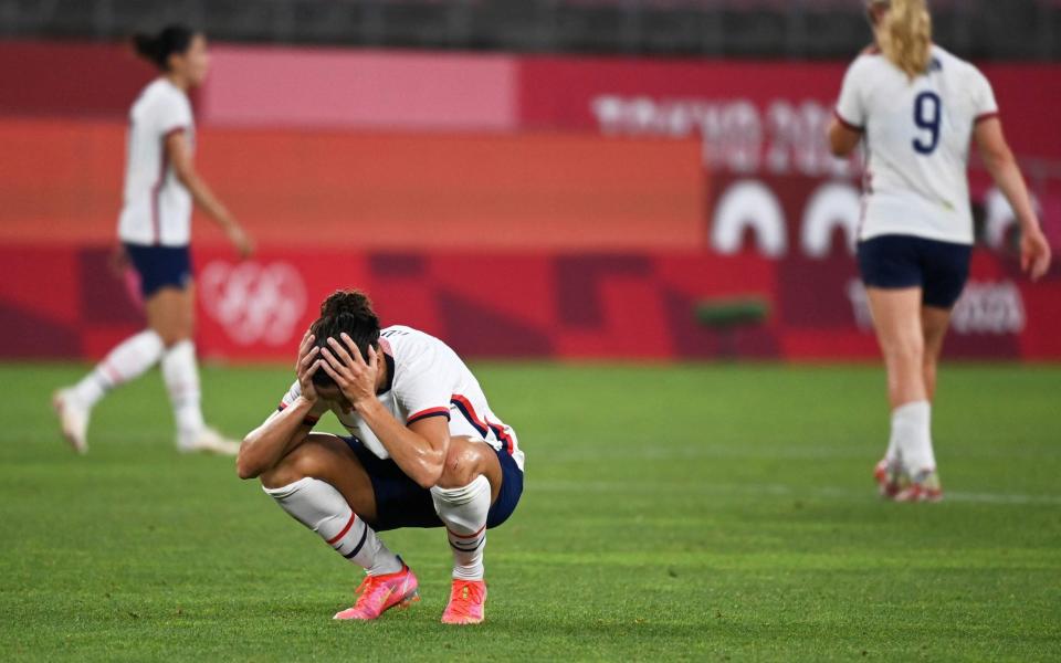 Carli Lloyd sinks down on her haunches at full time - GETTY IMAGES