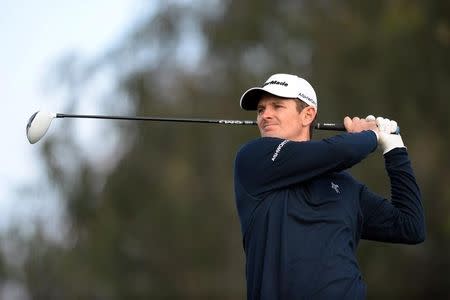 Feb 5, 2015; La Jolla, CA, USA; Justin Rose tees off on the 12th during the first round of the Farmers Insurance Open golf tournament at Torrey Pines Municipal Golf Course - South Course. Mandatory Credit: Jake Roth-USA TODAY Sports