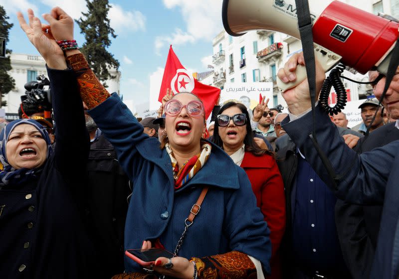 Tunisian activist Chaimaa Issa gestures during a protest against Tunisian President Kais Saied in Tunis