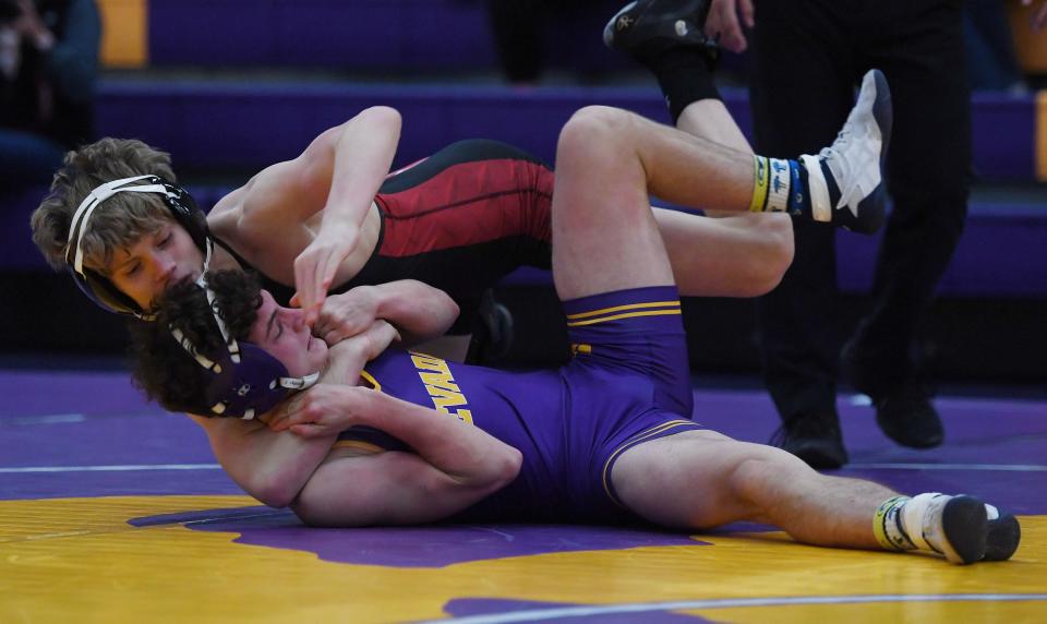 Roland-Story's Logan Powers scores a pin over Nevada's Christian DeCoske at 138 pounds during a 69-12 dual victory by the Norse over the Cubs Jan. 13 at the Nevada High School Field House.