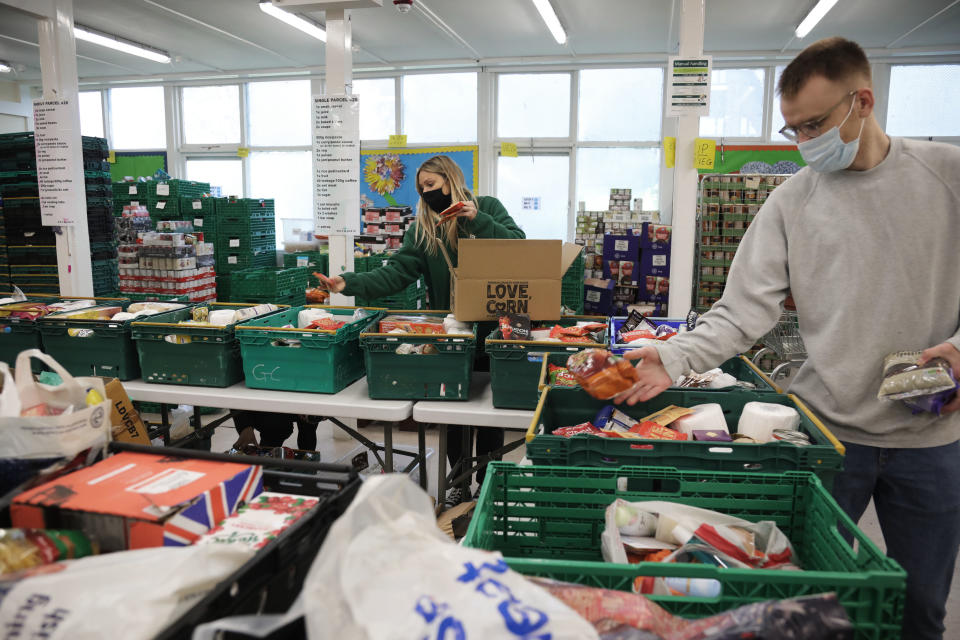 Workers and volunteers at Hackney Foodbank receive and organize food donations, 15th of December 2021, Hackney, East London, United Kingdom. The Hackney Food Bank is part of a nationwide network of foodbanks, supported by The Trussell Trust, working to combat poverty and hunger across the UK. The food bank gives out three days emergency food supplies to families and individual who go hungry in the borrough. The food is all donated by individuals and the food donated is held in a small ware house where it is  sorted and packed for distribution.  More people than ever in Britain have turned to the food bank for help and in Hackney the need has gone up with 350% over the past two years. (photo by Kristian Buus/In Pictures via Getty Images)