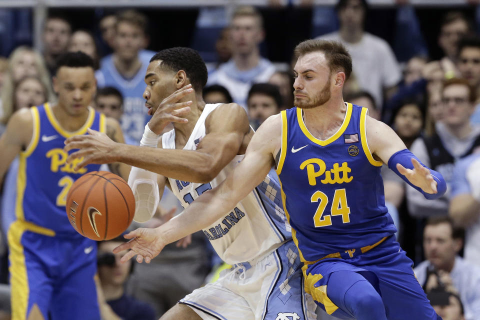 Pittsburgh guard Ryan Murphy (24) pressures North Carolina forward Garrison Brooks (15) during the second half of an NCAA college basketball game in Chapel Hill, N.C., Wednesday, Jan. 8, 2020. (AP Photo/Gerry Broome)