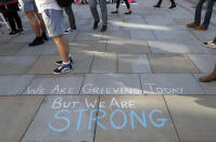 <p>A message is written on the pavement in Manchester, England, May 23, 2017, the day after the suicide attack at an Ariana Grande concert that left 22 people dead as it ended on Monday night. (Photo: Kirsty Wigglesworth/AP) </p>