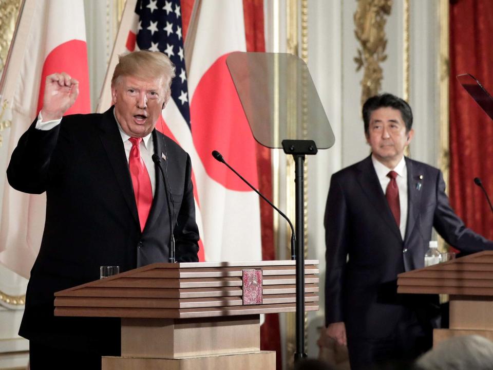 Donald Trump has said he is unfazed by North Korea’s recent short-range missile tests, putting him publicly at odds with Japanese prime minister Shinzo Abe who is hosting the US president on a state visit.The two leaders disagreed on the issue during a joint press conference designed to showcase US-Japan relations in Tokyo on Monday. Mr Abe, standing alongside Mr Trump following hours of talks, said Pyongyang’s missile tests earlier this month violated UN Security Council resolutions and were “of great regret”.He added the missiles posed a security threat to Japan, which neighbours North Korea. But Mr Trump said: “My people think it could have been a violation, as you know. I view it differently.”North Korean leader Kim Jong-un is a “smart man” who “perhaps … wants to get attention”, he suggested. “Who knows? It doesn’t matter,” the president added.Asked if he was “bothered” by the missile tests, he replied: “I’m not. I personally am not.” Mr Trump sought to downplay the significance of the missile tests, despite his own national security adviser, John Bolton, saying last week there was “no doubt” they had violated UN resolutions.North Korea’s foreign ministry on Monday lashed out at Mr Bolton, whom a Pyongyang spokesperson described as “more than ignorant” and “a structurally defective guy”.“Our military drill neither targeted anyone nor endangered the surrounding countries, but Bolton makes dogged claims that it constitutes a violation of the ‘resolutions’, impudently poking his nose into other’s internal matters,” North Korean state media quoted the spokesperson as saying.Mr Trump continues to hold out hope of persuading Mr Kim to relinquish his nuclear weapons and ballistic missiles, despite two rounds of talks with the North Korean leader breaking down with little progress.“All I know is there have been no nuclear tests, no ballistic missiles going out, no long-range missiles going out, and I think that someday we’ll have a deal,” the US president said during Monday’s press conference, although he added he was in “no rush”.During the press conference at Akasaka Palace in Tokyo, the leaders largely glossed over their differences on trade, despite the potentially crippling tariffs on foreign cars that Mr Trump is threatening to impose on Japan and the European Union. The US president declined to say what Japan would have to do to avoid those tariffs, but complained of an “unbelievably large” trade imbalance with the nation. Earlier on Monday, Mr Trump said he backed his Japanese counterpart’s interest in leveraging his country’s good relations with Iran to help broker dialogue between the US and its Middle Eastern adversary. Mr Abe could could visit Iran next month in a bid to diffuse escalating tensions between Washington and Tehran.Mr Trump’s talks with Mr Abe came hours after the US president became the first world leader to meet Japan’s new emperor, Naruhito, who ascended to the throne on 1 May.The meeting with Naruhito and his wife, Empress Masako, was preceded by a grand outdoor welcome ceremony at Japan’s Imperial Palace, where Mr Trump walked alone across red carpets, reviewing Japanese troops as the guest of honour.Mr Trump’s four-day state visit also included a round of golf with Mr Abe, the presentation of a trophy to a sumo wrestling champion, and dinner in Tokyo with the leaders’ wives.