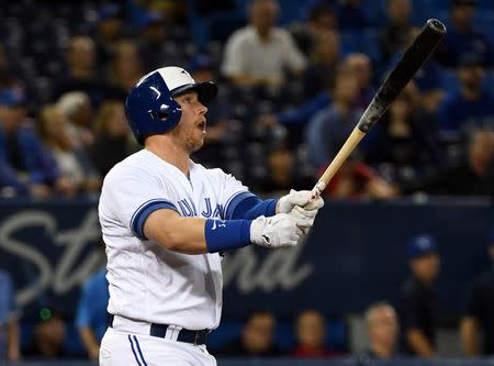 Sep 20, 2018; Toronto, Ontario, CAN; Toronto Blue Jays designated hitter Justin Smoak (14) hits a solo walk off home run in the ninth inning to give the Blue Jays a 9-8 win over Tampa Bay Rays at Rogers Centre. Mandatory Credit: Dan Hamilton-USA TODAY Sports