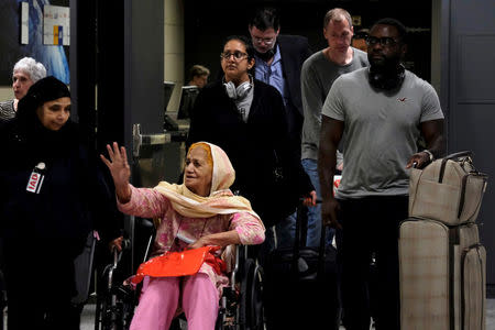 FILE PHOTO: International passengers arrive at Dulles International Airport in Dulles, Virginia, U.S. September 24, 2017. REUTERS/James Lawler Duggan/File Photo