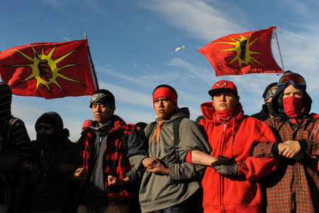 Protesters block a highway during a protest in Mandan against plans to pass the Dakota Access pipeline near the Standing Rock Indian Reservation, North Dakota, U.S. November 15, 2016. REUTERS/Stephanie Keith