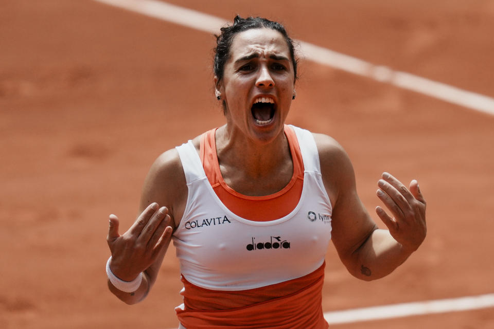 Italy's Martina Trevisan celebrates winning her quarterfinal match against Canada's Leylah Fernandez in three sets, 6-2, 6-7 (3-7), 6-3, at the French Open tennis tournament in Roland Garros stadium in Paris, France, Tuesday, May 31, 2022. (AP Photo/Thibault Camus)