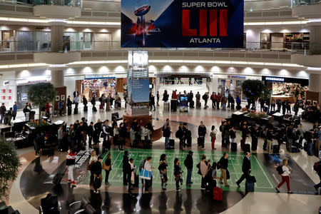 Lines of passengers waiting to pass through the main Transportation Security Administration (TSA) security checkpoint are seen at Hartsfield-Jackson Atlanta International Airport amid the partial federal government shutdown, in Atlanta, Georgia, U.S., January 18, 2019. REUTERS/Elijah Nouvelage