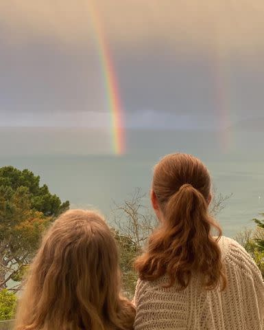 <p>Darren Le Gallo Instagram</p> Amy Adams and her daughter Aviana looking at a rainbow over the water