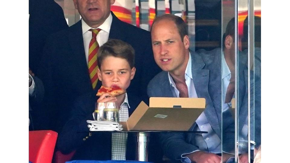 Prince George eats pizza on a day out at the Ashes with Prince William