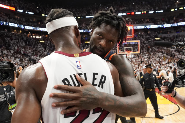 New York Knicks forward Julius Randle, right, and Miami Heat forward Jimmy Butler (22) congratulate each other after the Heat beat the Knicks 96-92 in Game 6 of an NBA basketball second-round playoff series, Friday, May 12, 2023, in Miami. (AP Photo/Wilfredo Lee)